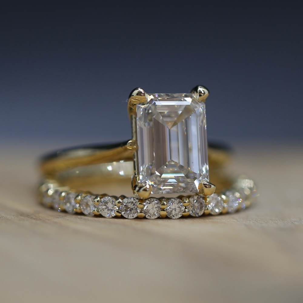 3 carat emerald cut diamond and eternity band